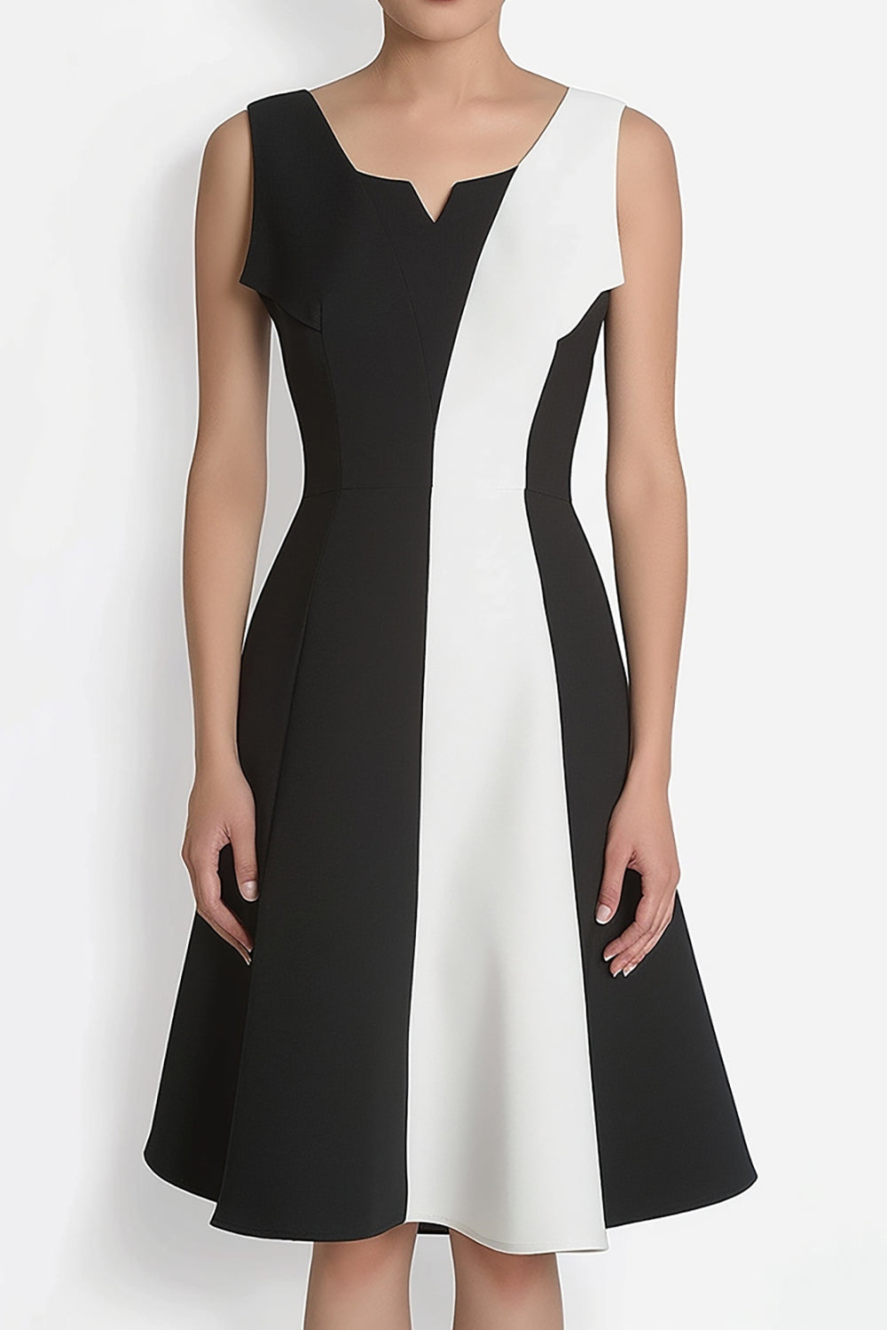 Woman in a black and white colorblock dress